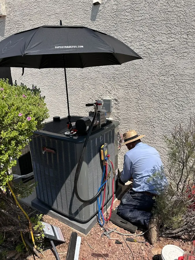 HVAC technician performing outdoor AC maintenance in South Union